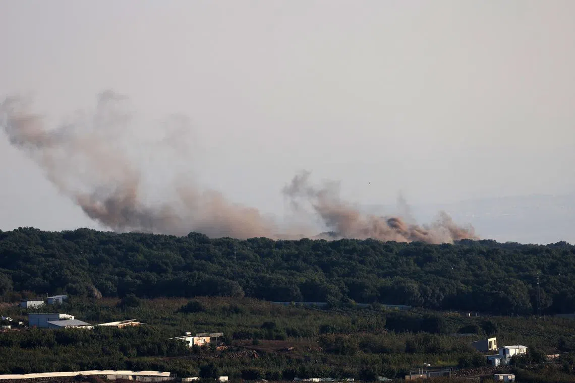 epa11531118 Smoke rises as a result of missiles fired from Lebanon in the northern part of the annexed Golan Heights, 06 August 2024. The Israeli army reported that the Aerial Defense Array successfully intercepted 40 missiles fired from Lebanon.  EPA-EFE/ATEF SAFADI
