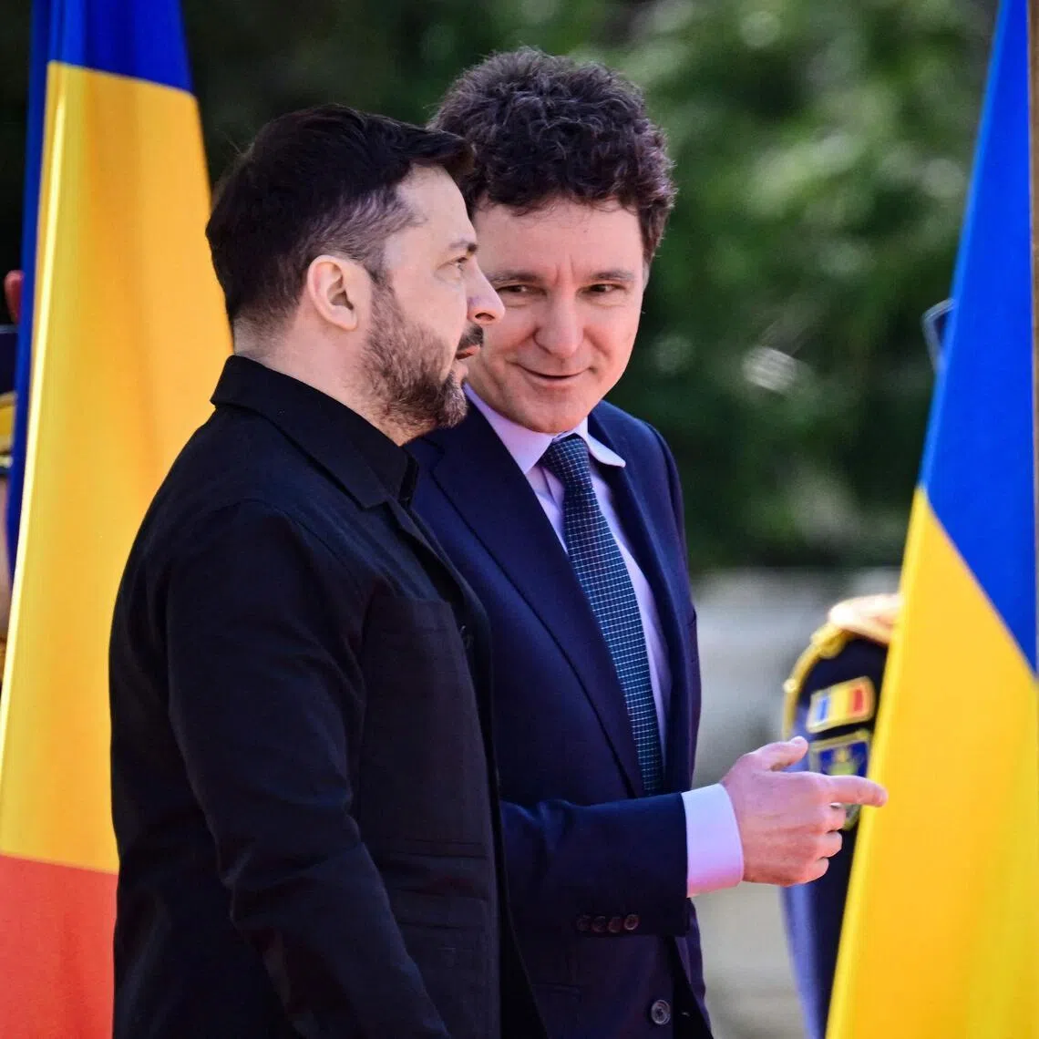 Romanian President Nicusor Dan (right) welcoming Ukrainian President Volodymyr Zelensky to Bucharest on March 12.