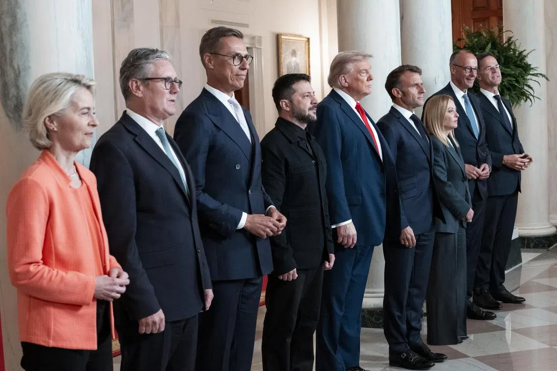 US President Donald Trump, Ukraine’s President Volodymyr Zelensky and other European leaders pose for a family photo at the White House. 
