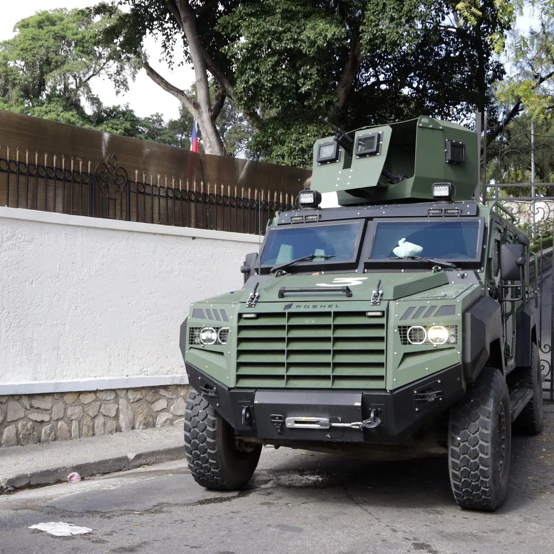 FILE PHOTO: Haitian security forces guard the Prime Minister's office and the headquarters of the Transitional Presidential Council (CPT), as the mandate of the transitional governing council, formed to curb gang violence and pave the way for long-delayed election, is set to end on February 7 with no succession plan in place, in Port-au-Prince, Haiti, February 6, 2026. REUTERS/Egeder Pq Fildor/File Photo