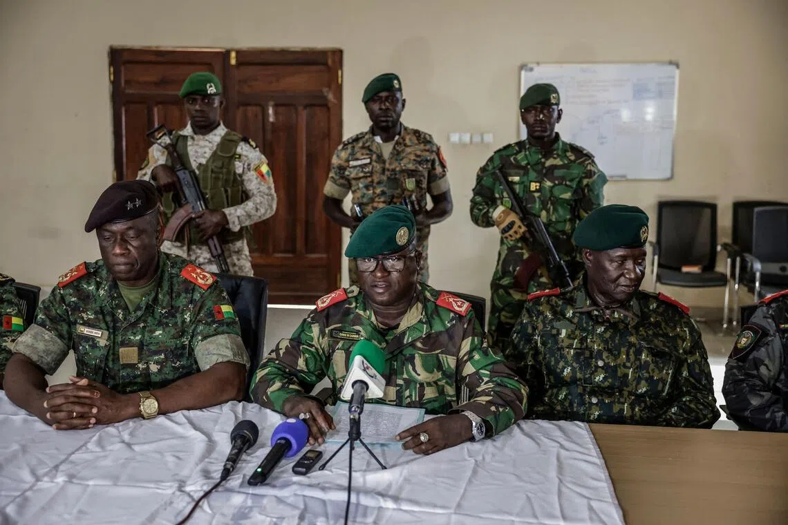 General Denis N'Canha (centre) delivering a press conference in Guinea-Bissau on Nov 26.