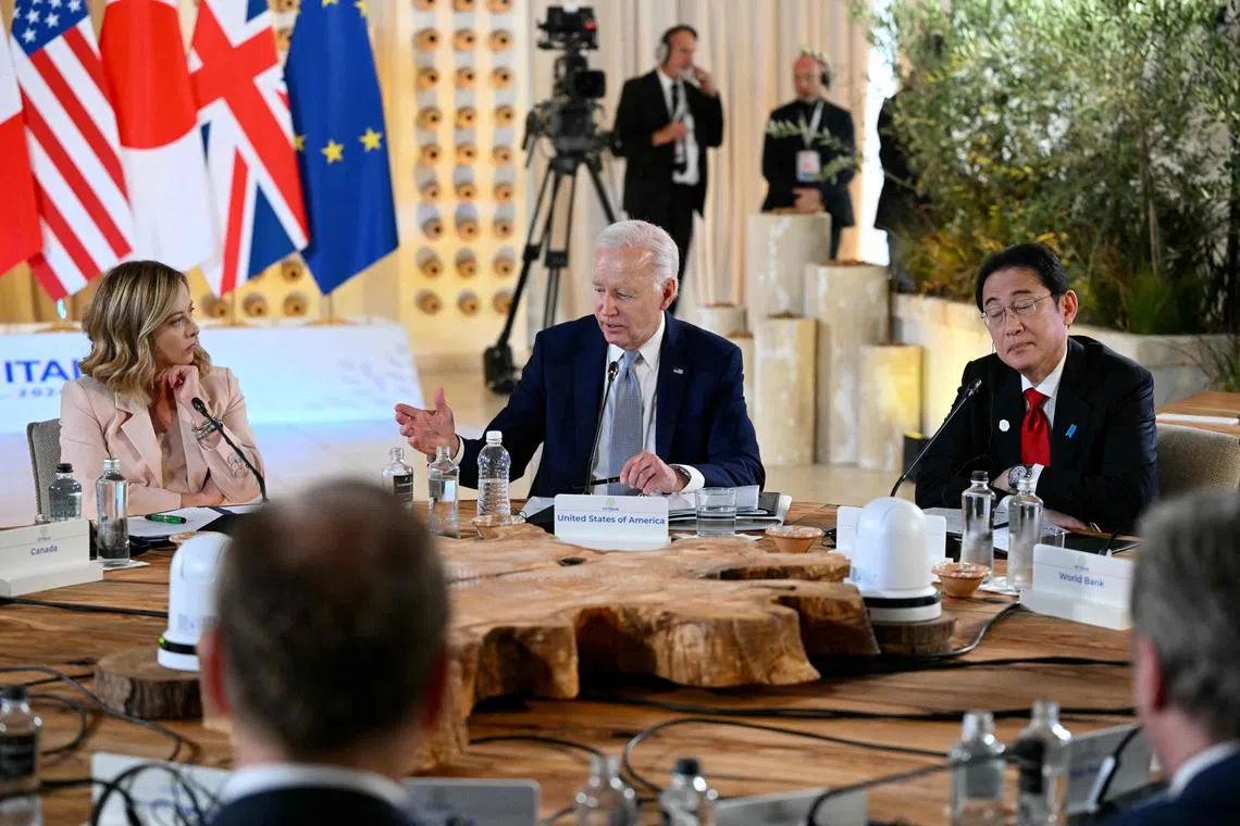 At the G-7 summit in Italy are (from left) Italy's Prime Minister Giorgia Meloni, US President Joe Biden and Japanese Prime Minister Fumio Kishida.