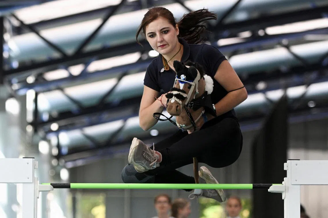 Daria Skrobisz, 20, participating with her hobby horse on the day of the first German Hobby Horsing Championship in Frankfurt, Germany on September 15, 2024.  