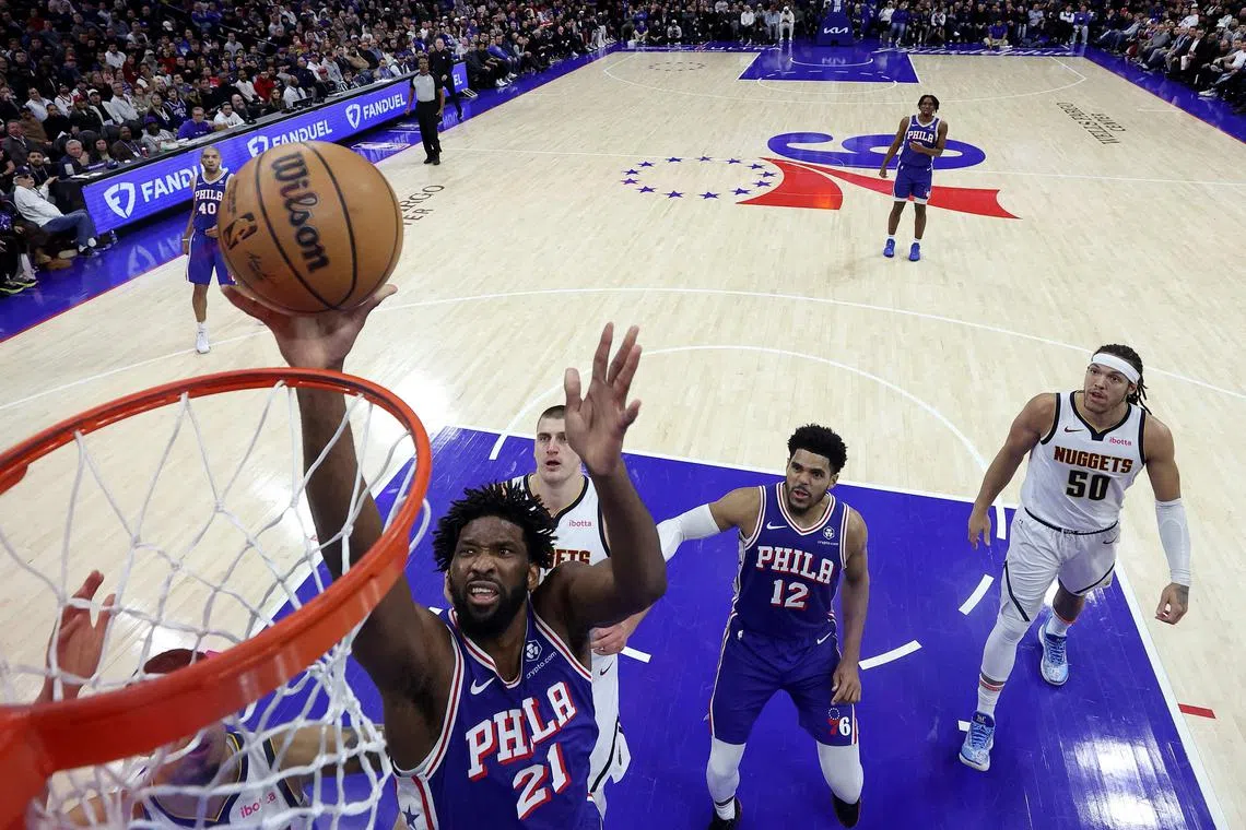 Joel Embiid of the Philadelphia 76ers shoots a layup during the second quarter against the Denver Nuggets at the Wells Fargo Centre.