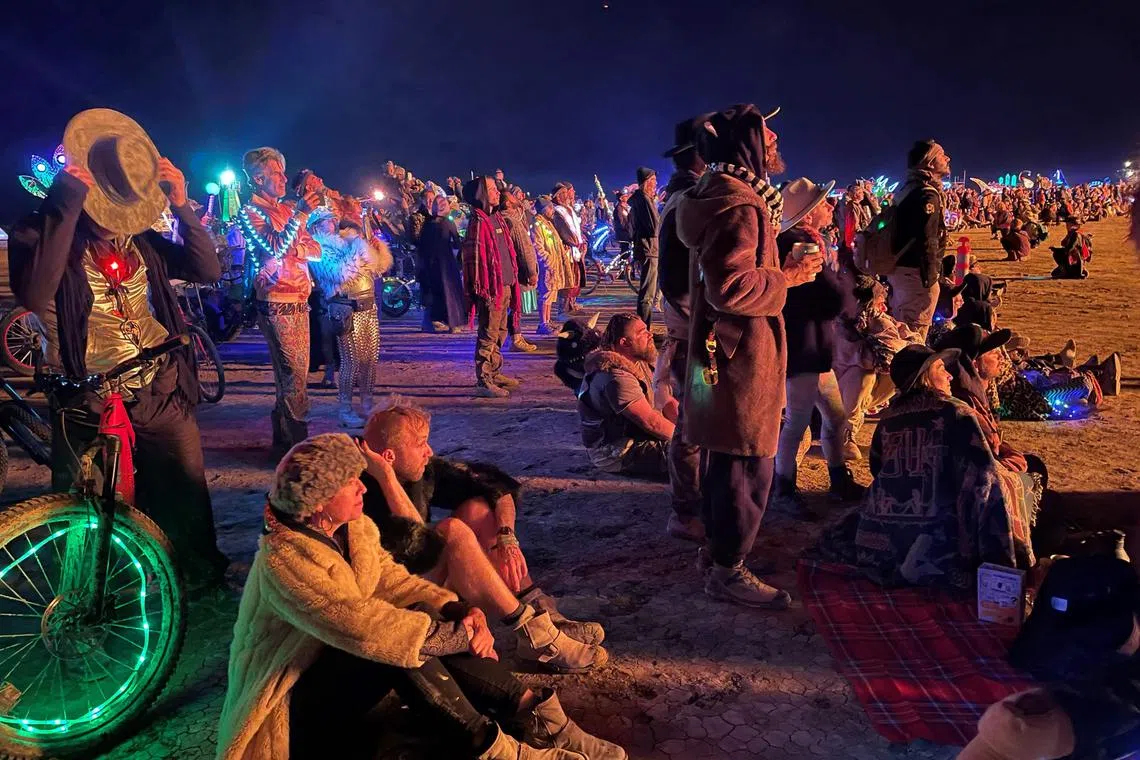 Thousands of revelers stuck in the mud for days at the Burning Man festival in the US state of Nevada were told they could finally trek home.