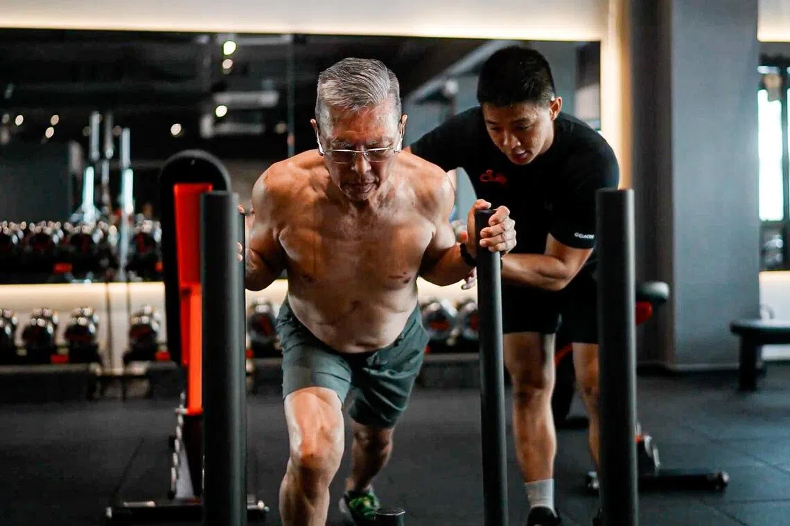 Philip Chia (left) with trainer Seong King Khor from Surge Strength & Results gym.