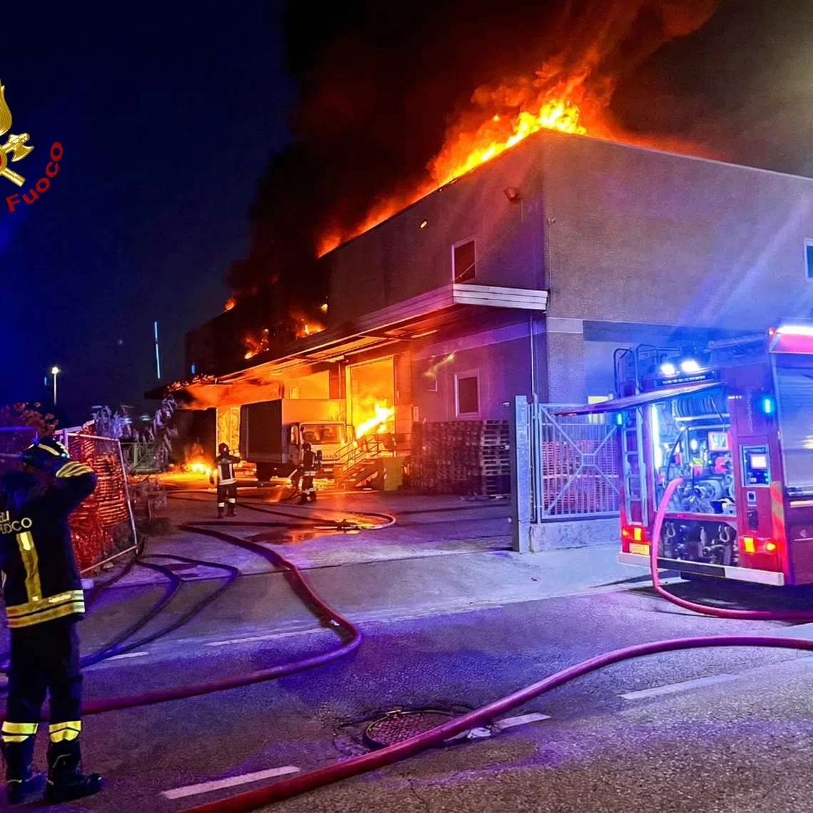 Italian fire brigade tackle a suspected arson attack on a Chinese business in the Tuscan city of Prato, Italy, in this handout photo obtained by Reuters. Vigili del Fuoco/Handout via REUTERS ATTENTION EDITORS – THIS IMAGE WAS PROVIDED BY A THIRD PARTY. WATERMARK PROVIDED AT SOURCE.