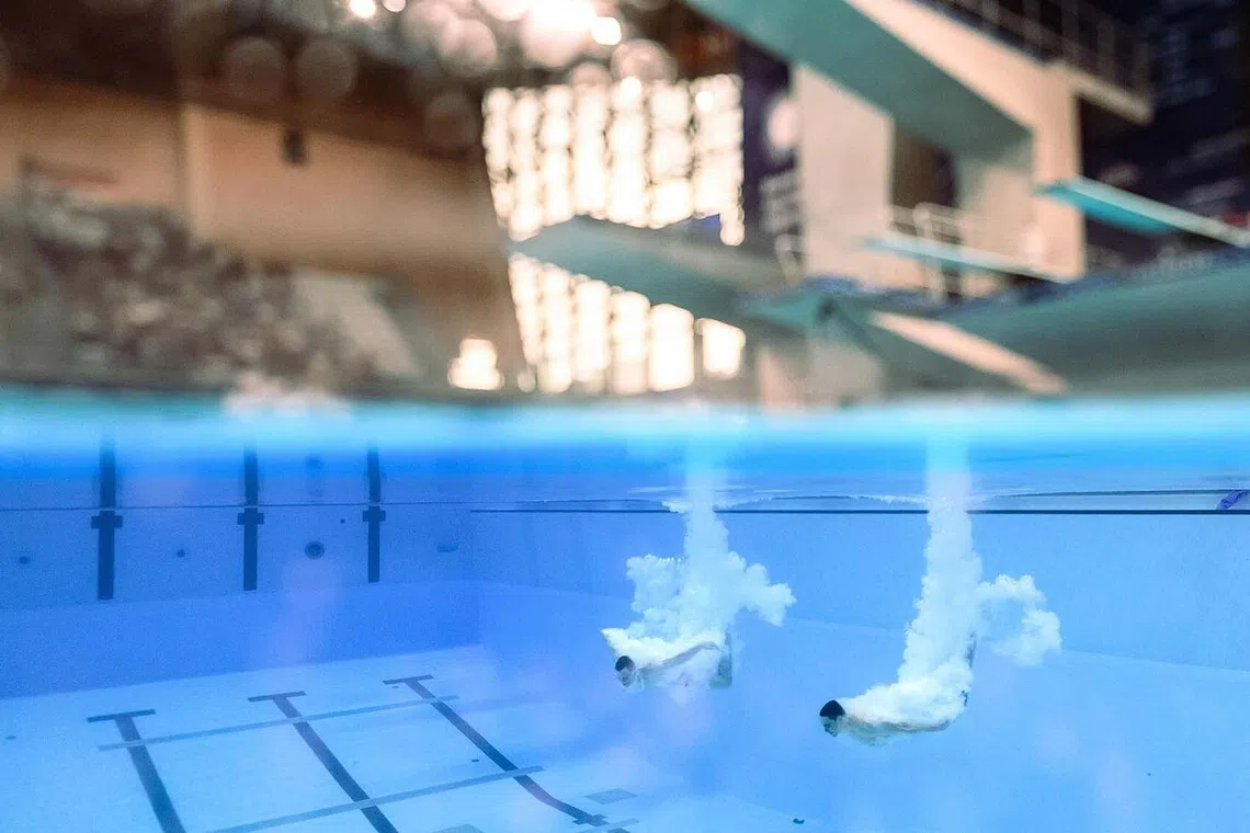 TOPSHOT - Germany's diver Lou Noel Guy Massenberg and Jonathan Gisbert Schauer compete in the men’s 3m springboard synchro final diving event during the LEN European Aquatics Championships, at the Olympic Aquatics Centre in Saint-Denis, northeastern suburbs of Paris, on August 3, 2026. (Photo by SEBASTIEN BOZON / AFP)
