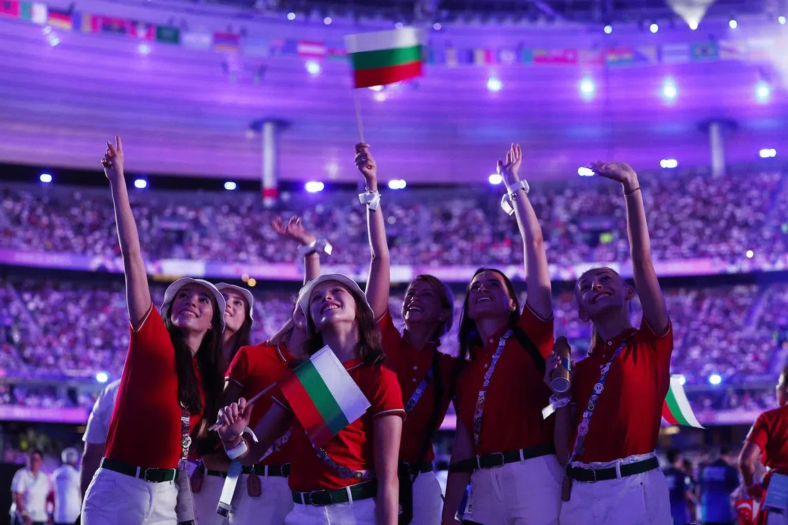 Bulgaria athletes waving to spectators at the closing ceremony of the Paris Olympics at the Stade de France on Aug 11, 2024.