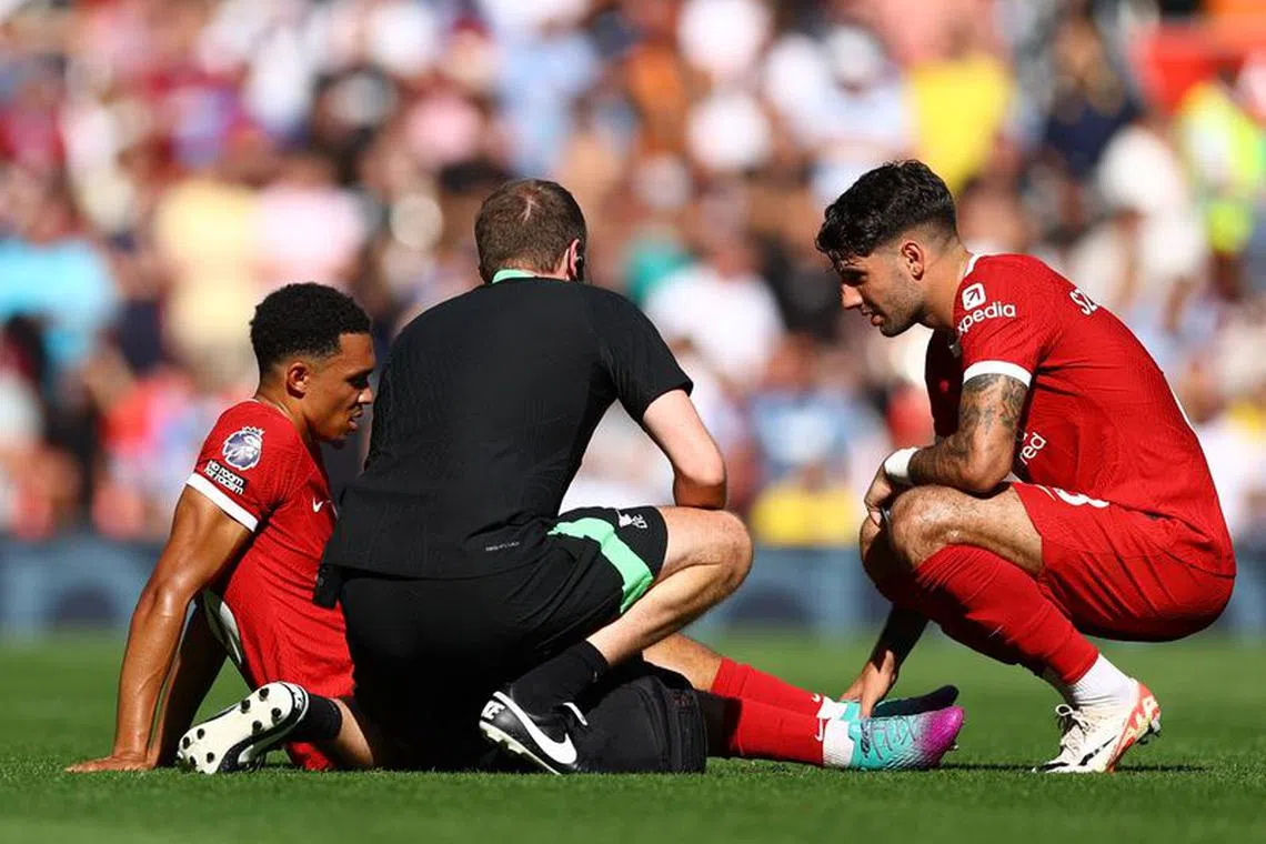 FILE PHOTO: Soccer Football - England - Premier League - Liverpool v Aston Villa - Anfield, Liverpool, Britain - September 3, 2023 Liverpool's Trent Alexander-Arnold receives medical attention REUTERS/Molly Darlington/File Photo