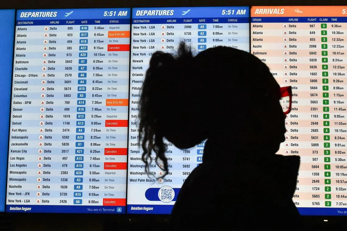 Several cancelled flights are displayed on a departures board at Boston’s airport on Nov 10, 2025.
