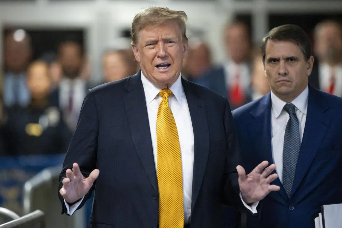 Former US President Donald Trump and his attorney Todd Blanche speak to the press at the New York State Supreme Court.