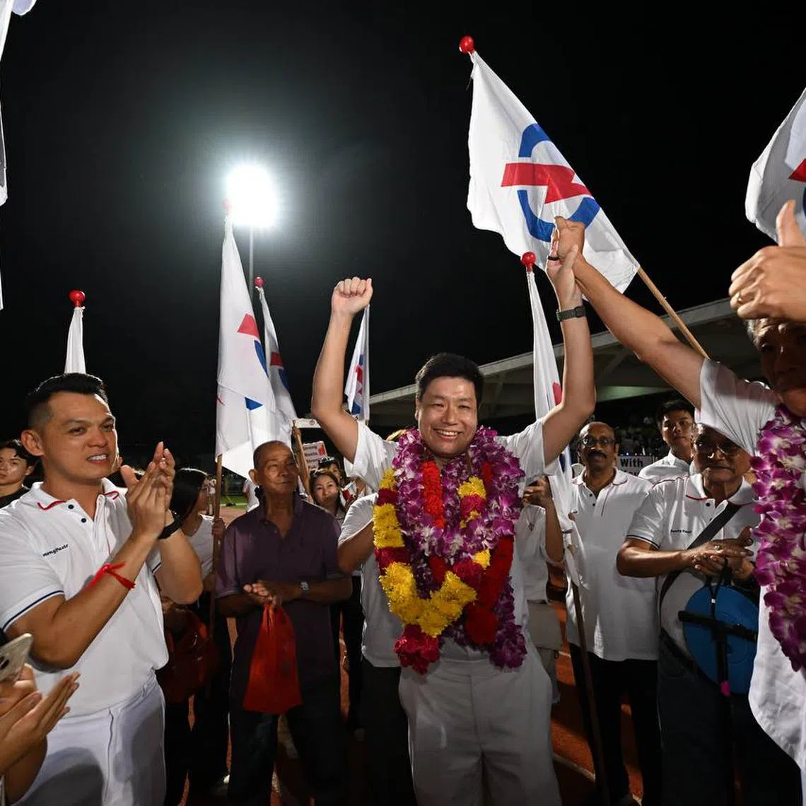 The PAP's Potong Pasir candidate Alex Yeo (centre) celebrating with supporters at Yio Chu Kang Stadium on May 3.