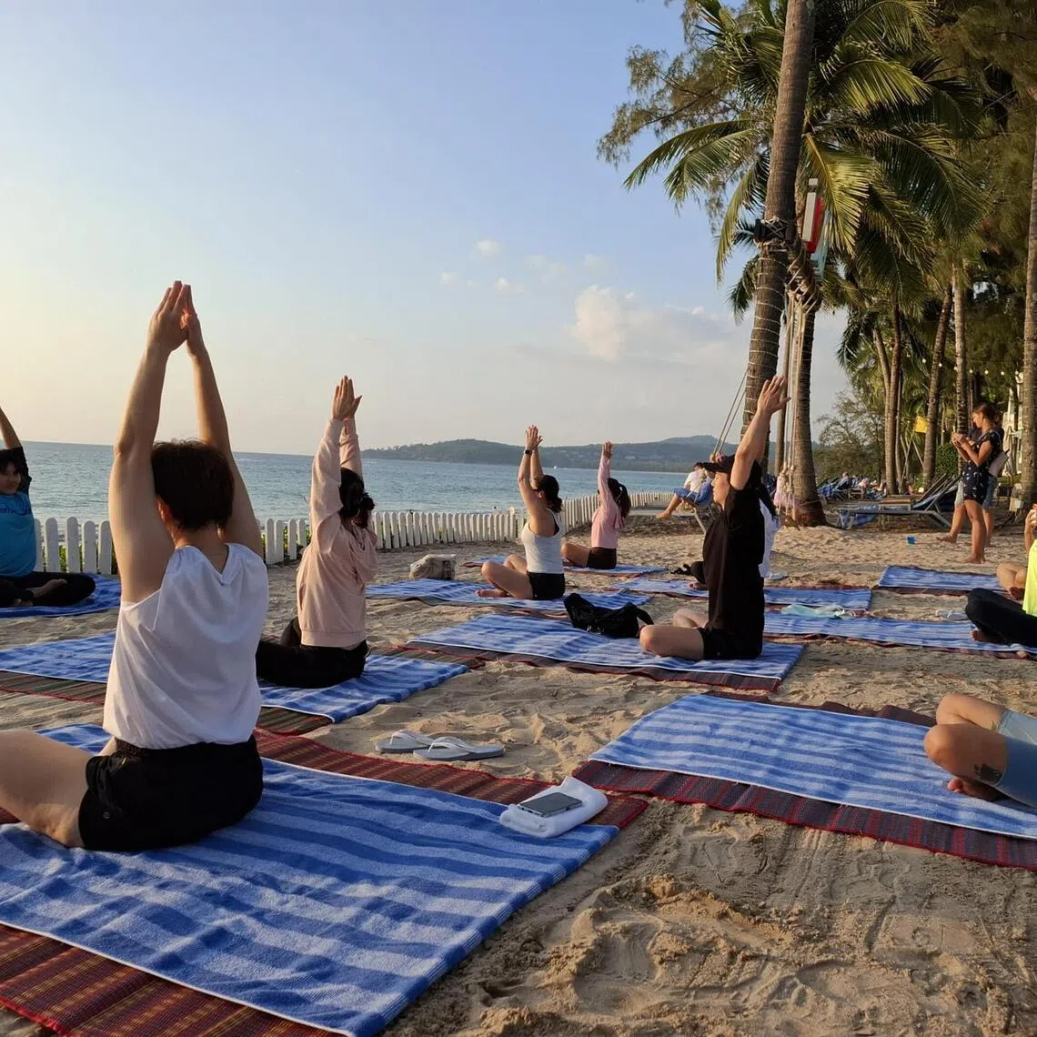 A sunset yoga class is part of the wellness programme at SAii Laguna Phuket. 