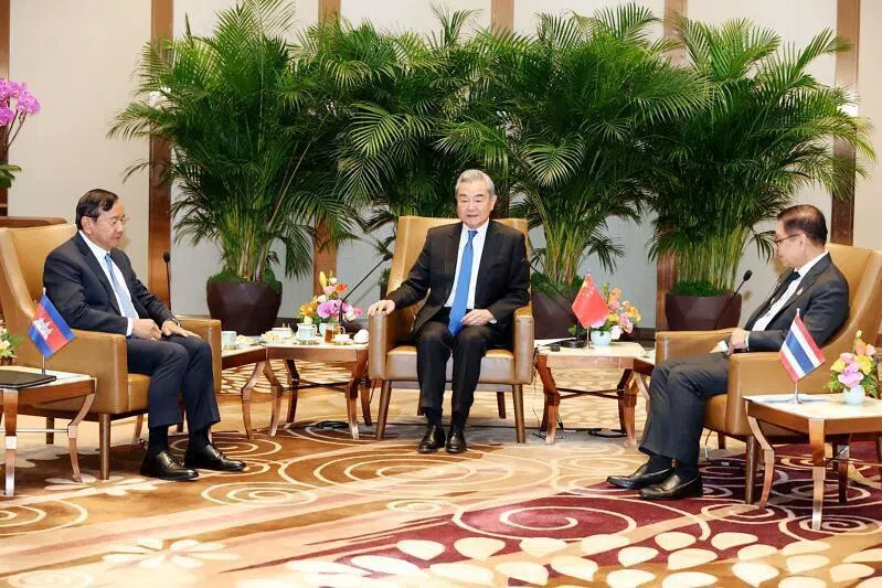China‘s Foreign Minister Wang Yi (centre) speaking as Cambodia‘s Deputy Prime Minister Prak Sokhonn (left), who is also the country’s Foreign Minister, and Thailand‘s Foreign Minister Sihasak Phuangketkeow (right) listen during a meeting in China‘s Yunnan province on Dec 29.