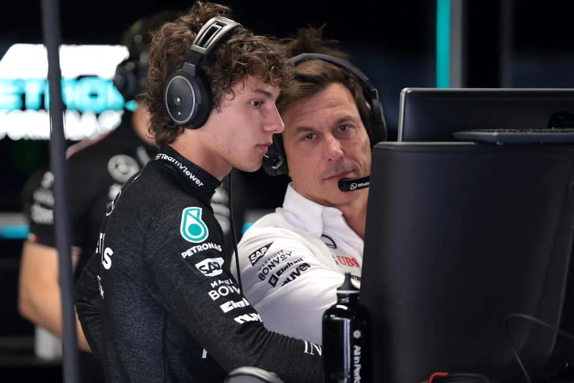 FILE PHOTO: Formula One F1 - Italian Grand Prix - Autodromo Nazionale Monza, Monza, Italy - August 30, 2024 Mercedes team principal Toto Wolff talks to Mercedes' Andrea Kimi Antonelli during practice REUTERS/Claudia Greco/File Photo