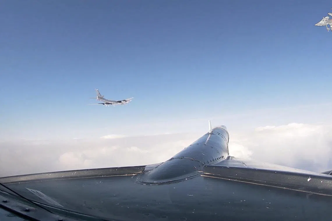 A still image from video released by the Russian Defence Ministry shows a Russian TU-95MS strategic bomber performing a flight over neutral waters of the Bering Sea near the west coast of Alaska, video released on May 3, 2024. Russian Defence Ministry/Handout via REUTERS ATTENTION EDITORS - THIS IMAGE HAS BEEN SUPPLIED BY A THIRD PARTY. NO RESALES. NO ARCHIVES. MANDATORY CREDIT.