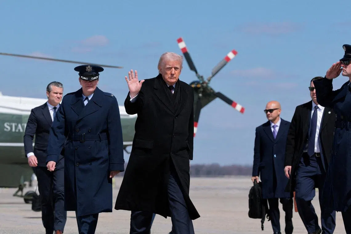 FILE PHOTO: U.S. President Donald Trump gestures as he boards Air Force One to travel to Dover Air Force Base, as he departs from Joint Base Andrews, Maryland, U.S., March 18, 2026. REUTERS/Kylie Cooper/File Photo