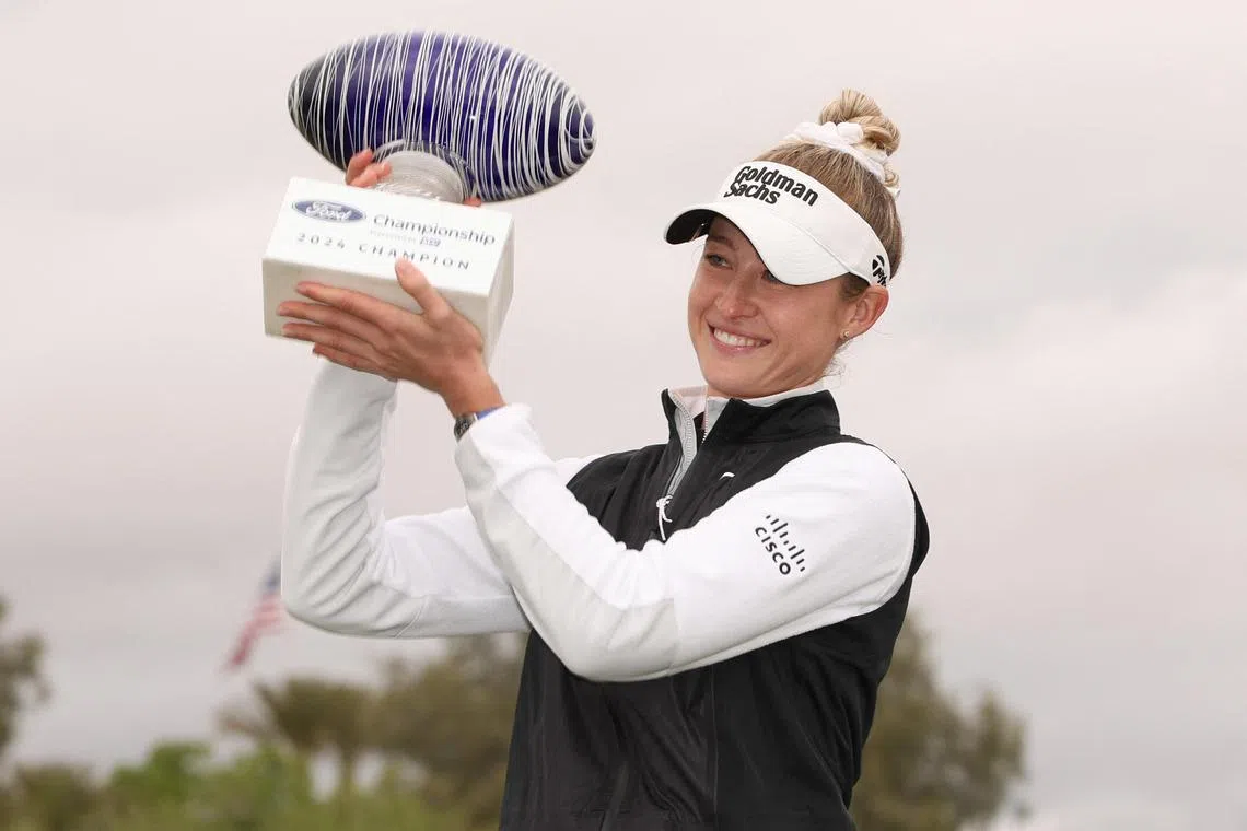 Nelly Korda posing with the trophy after the final round of the Ford Championship.