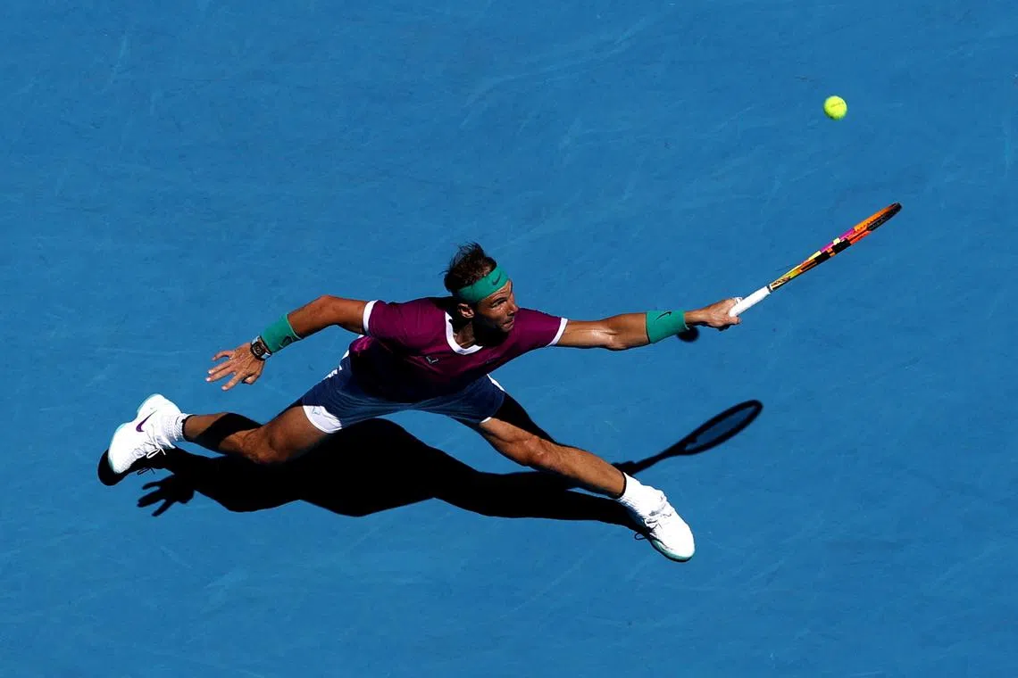 FILE PHOTO: Tennis - Australian Open - Melbourne Park, Melbourne, Australia - January 19, 2022  Spain's Rafael Nadal in action during his second round match against Germany's Yannick Hanfmann REUTERS/Loren Elliott/File Photo
