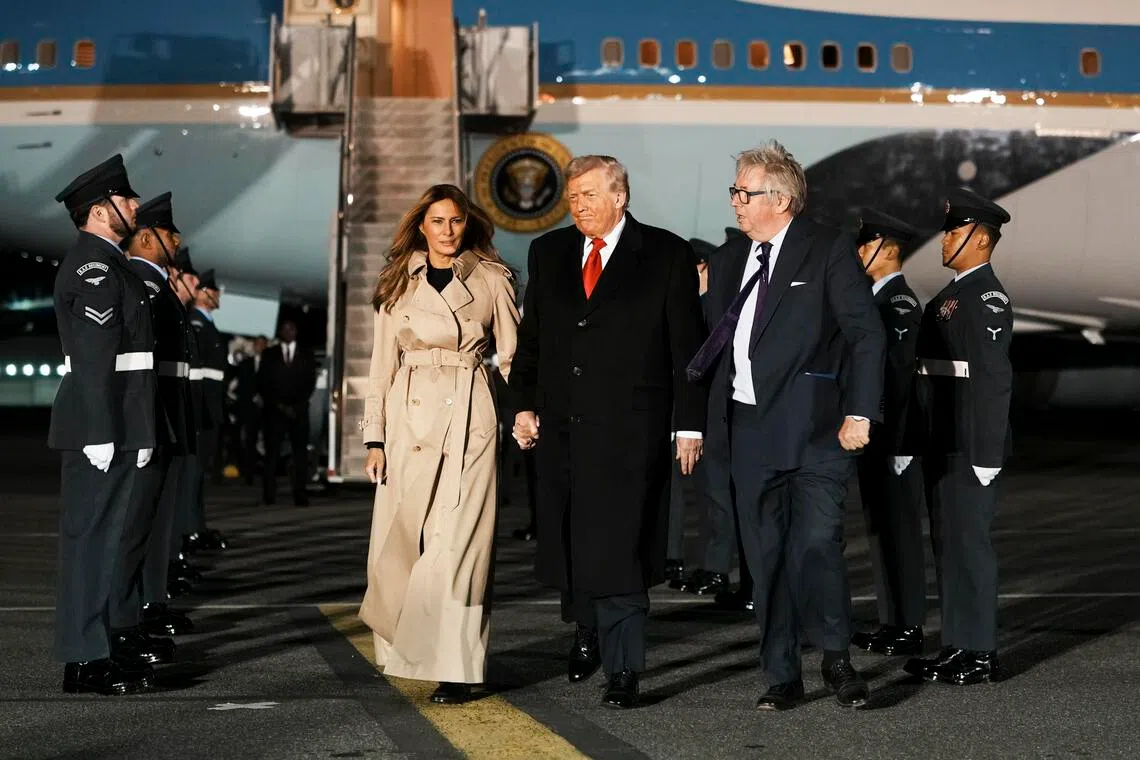 President Donald Trump and first lady Melania Trump walk with Viscount Henry Hood, representing King Charles III of Britain, after they arrived on Air Force One at London Stansted Airport in Stansted, England, on Tuesday, Sept. 16, 2025. (Doug Mills/The New York Times)