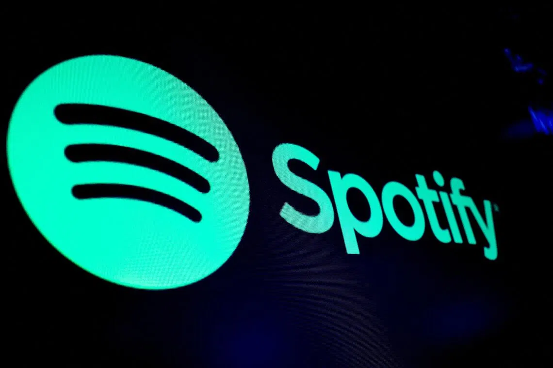 FILE PHOTO: A screen displays the logo of Spotify on the floor at the New York Stock Exchange (NYSE) in New York City, U.S., December 4, 2023.  REUTERS/Brendan McDermid/File Photo