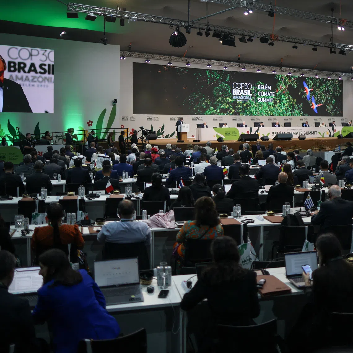 United Nations Secretary-General Antonio Guterres appears on screens as he speaks at the opening of the Belem Climate Summit plenary session, as part of the United Nations Climate Change Conference (COP30), in Belem, Brazil, November 6, 2025. REUTERS/Adriano Machado