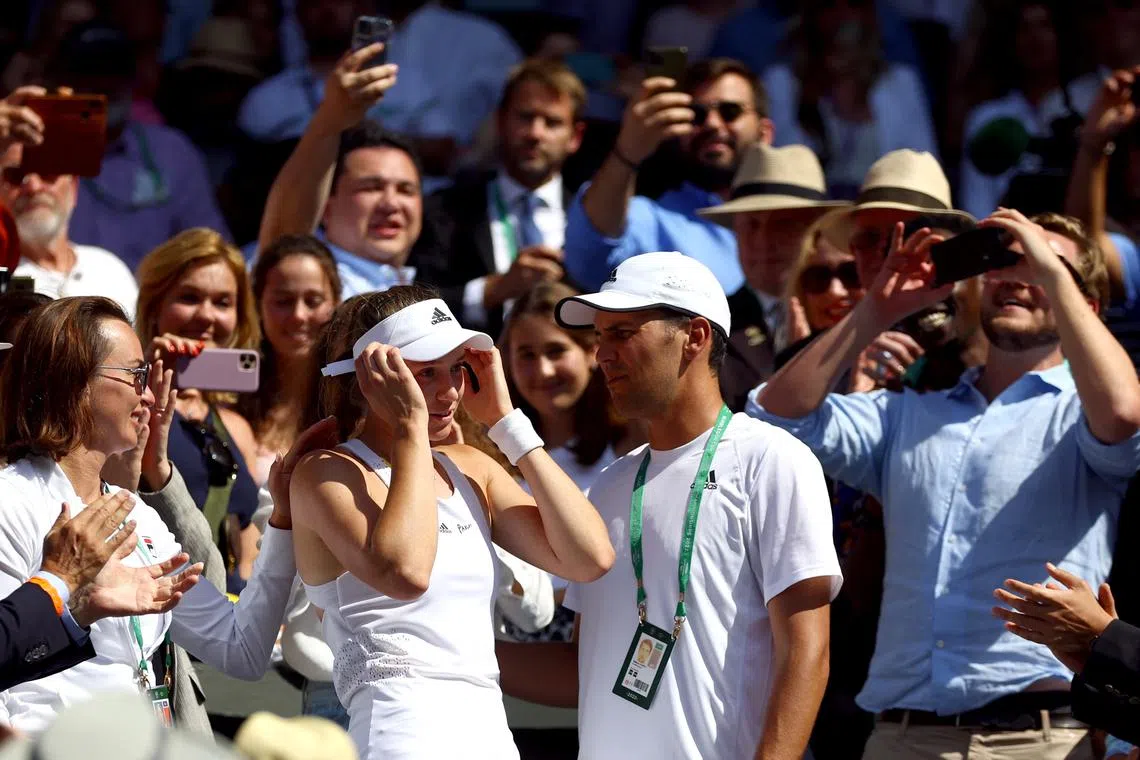 FILE PHOTO: Tennis - Wimbledon - All England Lawn Tennis and Croquet Club, London, Britain - July 9, 2022  Kazakhstan's Elena Rybakina celebrates with coach Stefano Vukov after winning the women's singles final against Tunisia's Ons Jabeur REUTERS/Hannah Mckay/File Photo