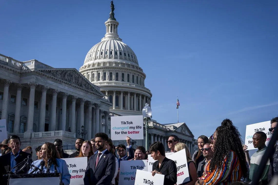 Lawmakers and TikTok creators during a press conference outside the U.S. Capitol in Washington, on March 12, 2024. The House on Wednesday, April 17, 2024, made another push to force through legislation that would require the sale of TikTok by its Chinese owner or ban the app in the United States, accelerating an effort to disrupt the popular social media app. The measure will be considered alongside a package of foreign aid for Ukraine, Israel and Taiwan. (Haiyun Jiang/The New York Times)