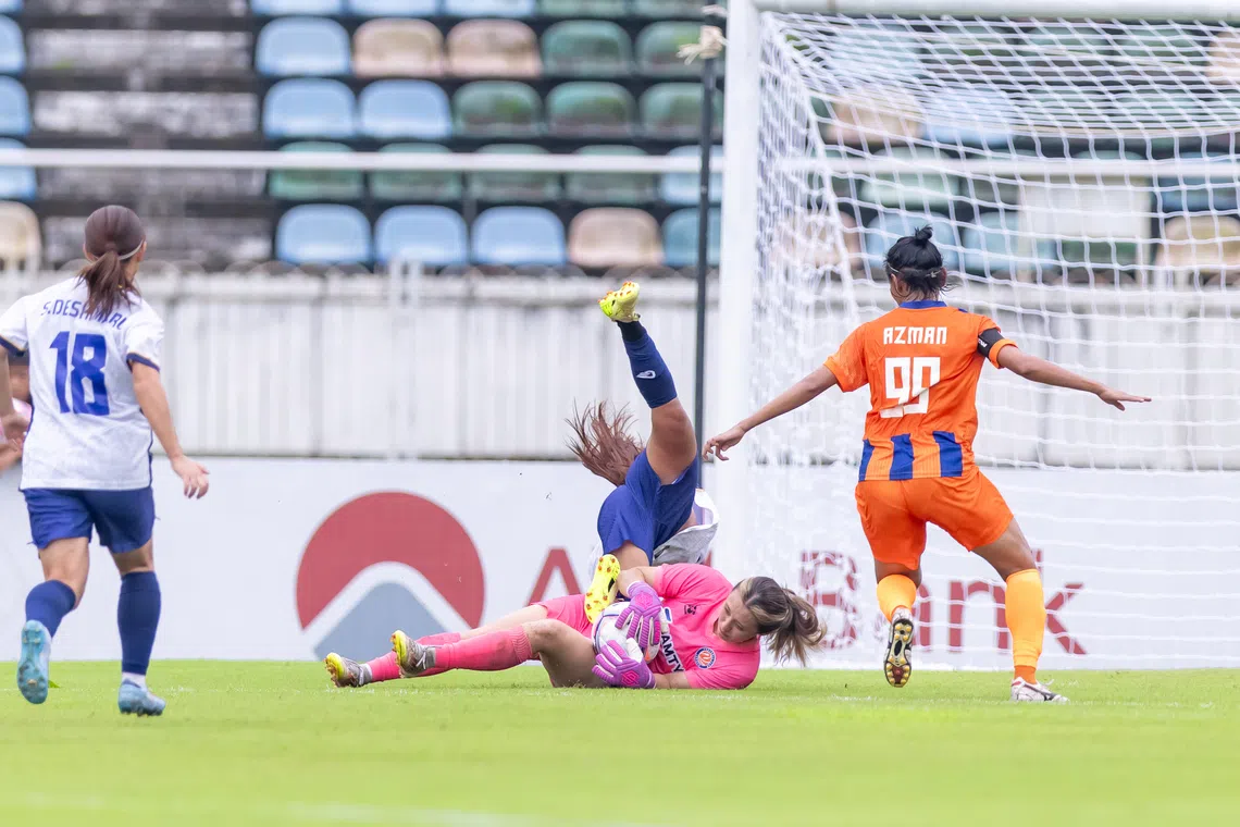 FC Jurong goalkeeper Hazel Lim coming out to claim the ball during an AFC Women’s Champions League preliminary-stage match against Ayeyawady FC  in Myanmar on Aug 17.