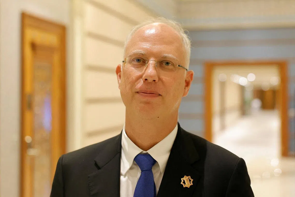 FILE PHOTO: The head of Russia's sovereign wealth fund Kirill Dmitriev poses for a picture after the U.S.-Russia talks in Riyadh, Saudi Arabia, February 18, 2025. REUTERS/Maxim Shemetov/File Photo