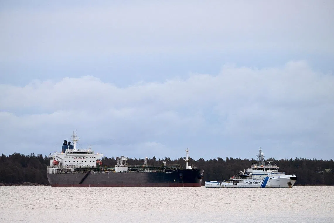 FILE PHOTO: Finnish Coast Guard Uisko keeps watch on oil tanker Eagle S anchored near the Kilpilahti port in Porvoo, on the Gulf of Finland, December 30, 2024.Lehtikuva/Jussi Nukari via REUTERS/File Photo
