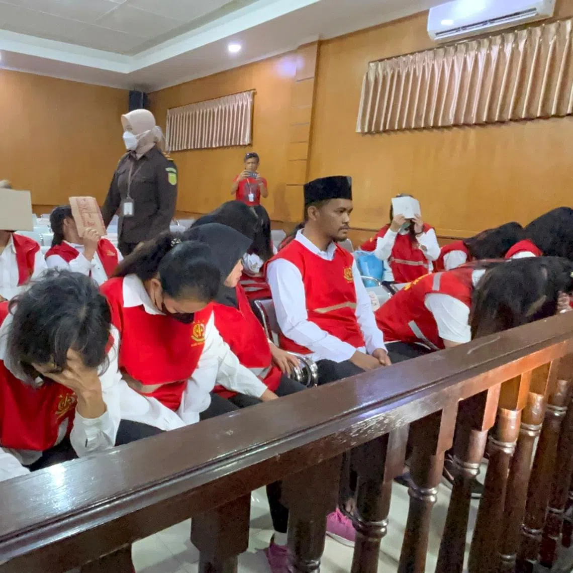 Members of an Indonesian baby-smuggling syndicate at the Bandung District Court in West Java on July 21.