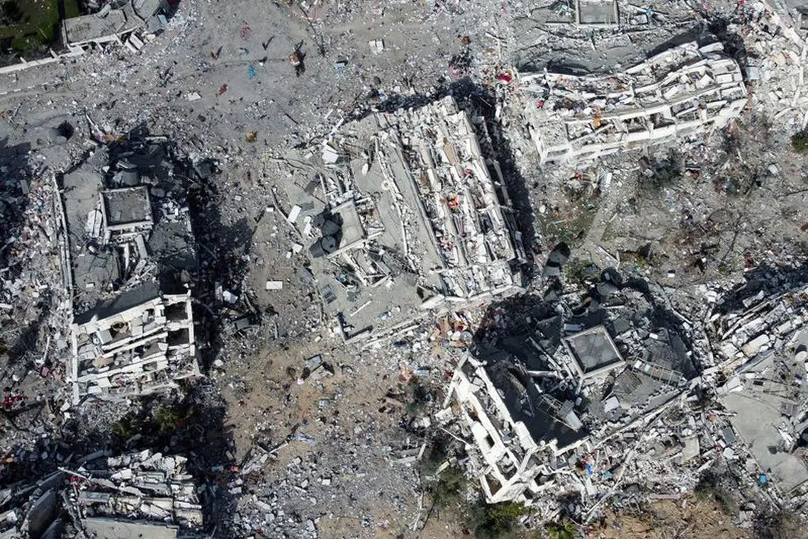 Residential buildings, destroyed in Israeli strikes during the conflict, lie in ruin, amid a temporary truce between Israel and the Palestinian Islamist group Hamas, in southern Gaza City November 26, 2023. REUTERS/Bassam Masoud