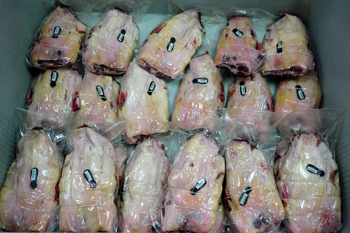 Spanish hams vacuum packed are seen at a factory in Guijuelo, Spain, April 14, 2020. REUTERS/Juan Medina/File Photo