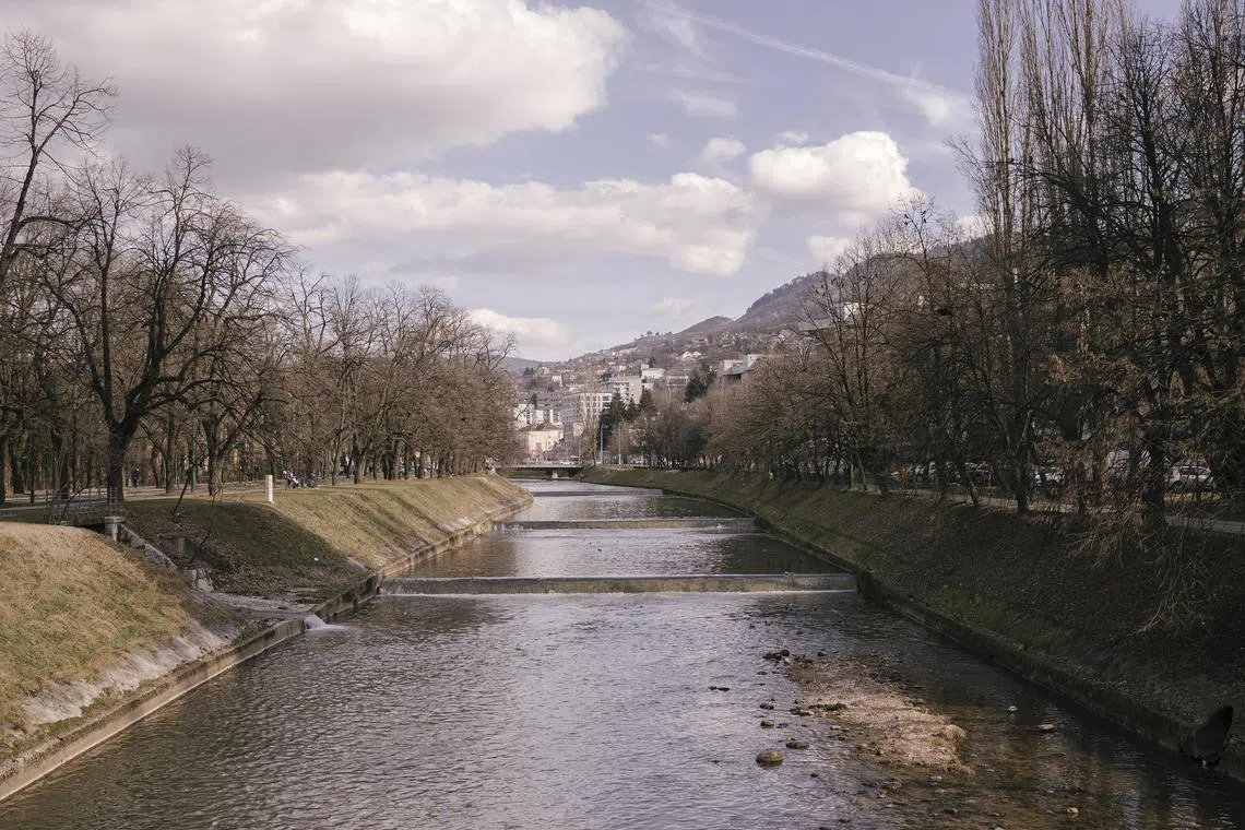 The Miljacka River in Sarajevo, Bosnia and Herzegovina, Feb. 7, 2024. Bosnia is being hit by a combination of a low birthrate and emigration, a trend fueled by ethnic tensions and disgust with corruption. (Vladimir Zivojinovic/The New York Times)