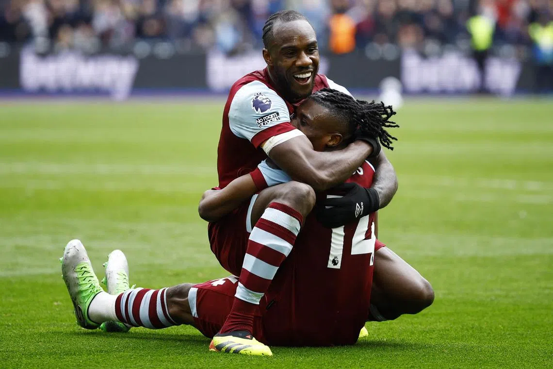 West Ham United's Michail Antonio celebrates scoring their second goal with Mohammed Kudus in the English Premier League clash with Liverpool.
