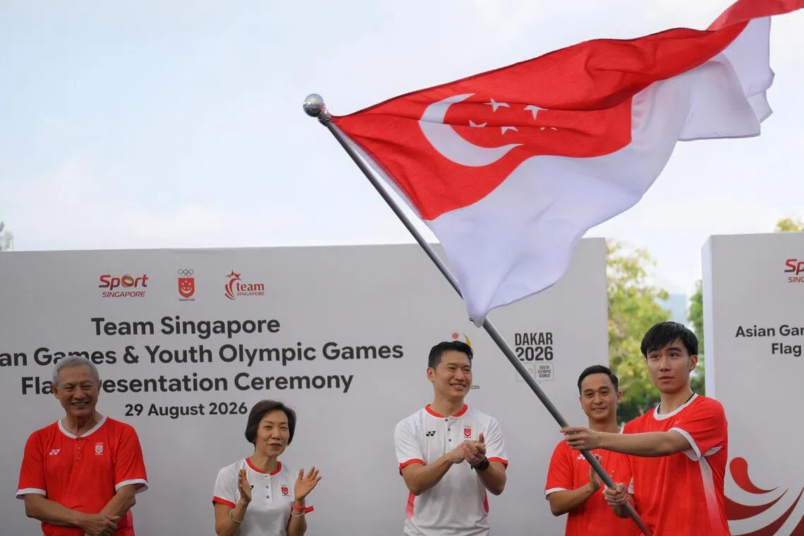 Badminton player Zack Ng (far right) will carry the flag with table tennis player Loy Ming Ying at the 2026 Youth Olympic Games in Dakar, Senegal.