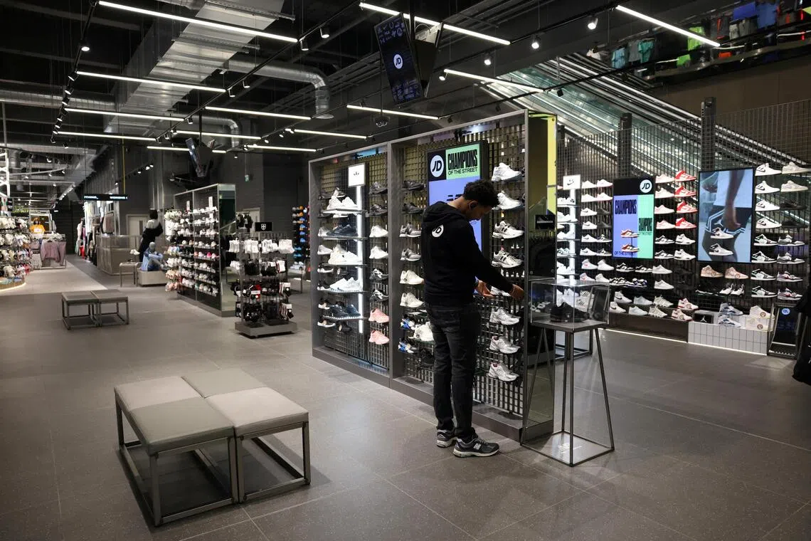 JD Sports cut its profit outlook as its customers grapple with cost-of-living pressures.