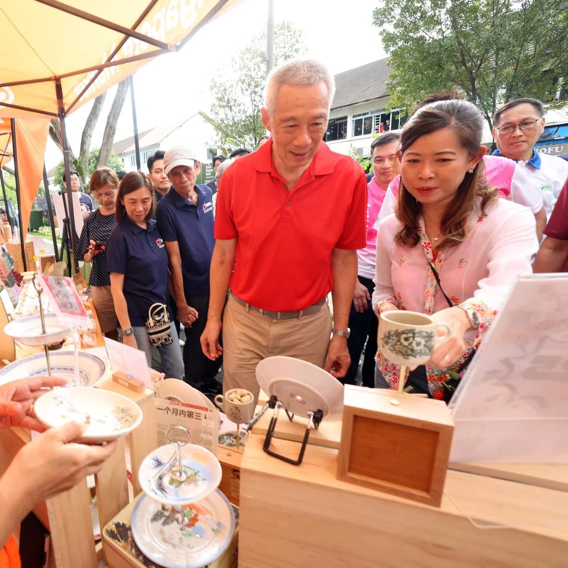 Senior Minister Lee Hsien Loong and fellow Ang Mo Kio GRC MP Ng Ling Ling at a residents’ carnival in Seletar Hills on March 23.