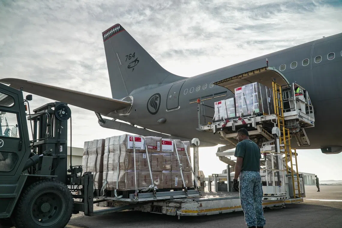 Humanitarian supplies being unloaded from the Republic of Singapore Air Force's A330 Multi-Role Tanker Transport on Nov 30 after it arrived in Egypt.