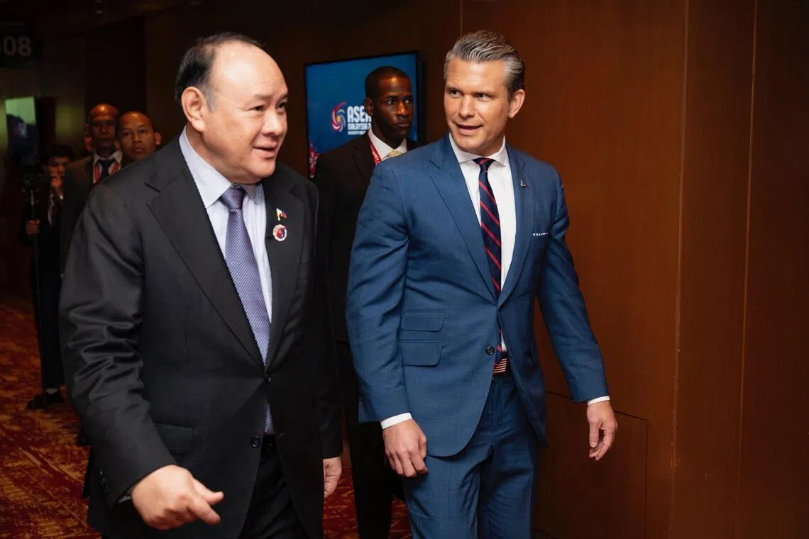 US Secretary of War Pete Hegseth (right) meets with Philippine Defence Secretary Gilberto Teodoro Jr (left) in Malaysia on October 31, 2025 to establish Task Force Philippines. 