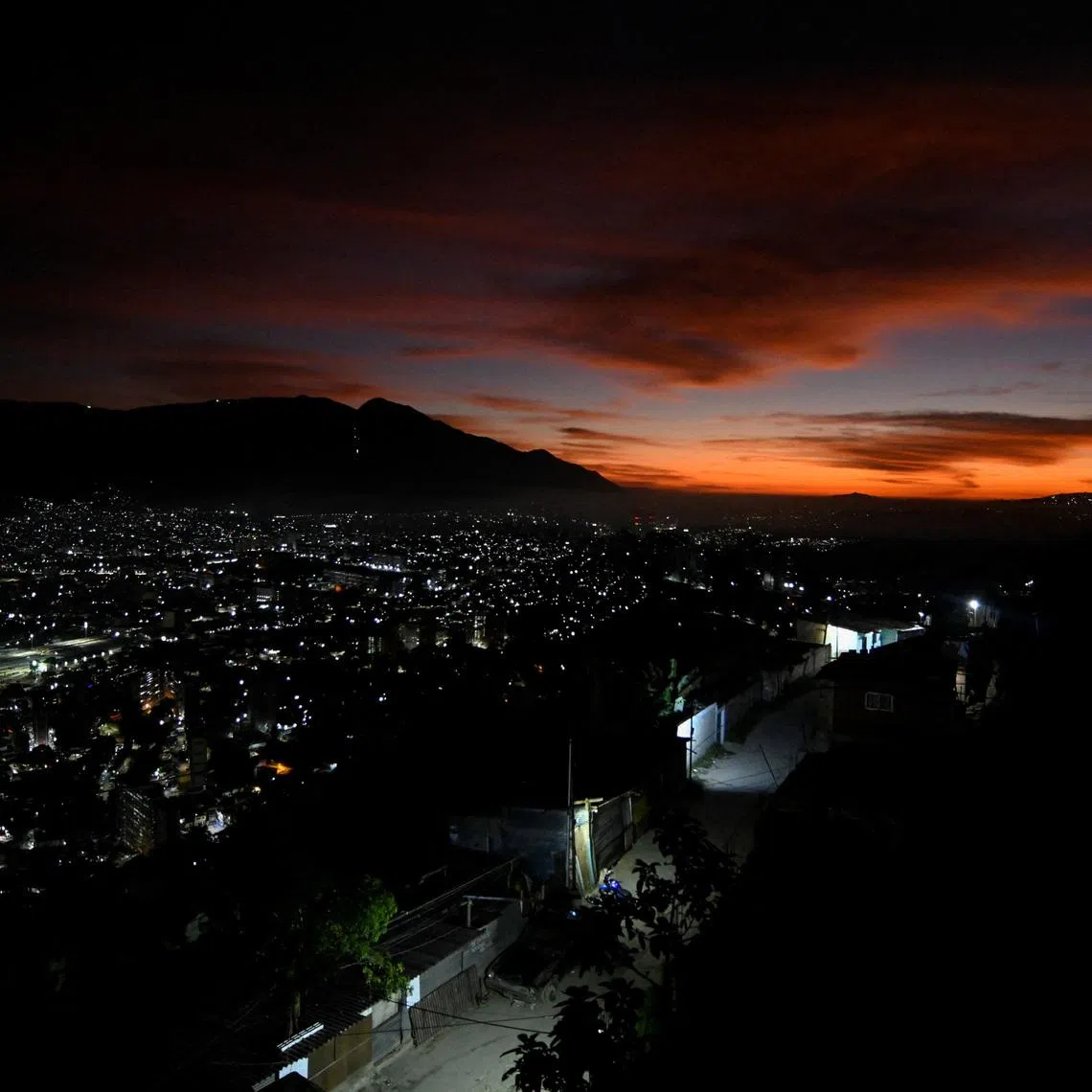 The sun rises after U.S. President Donald Trump said on Saturday the U.S. has struck Venezuela and captured its President Nicolas Maduro, in Caracas, Venezuela January 3, 2026. REUTERS/Maxwell Briceno
