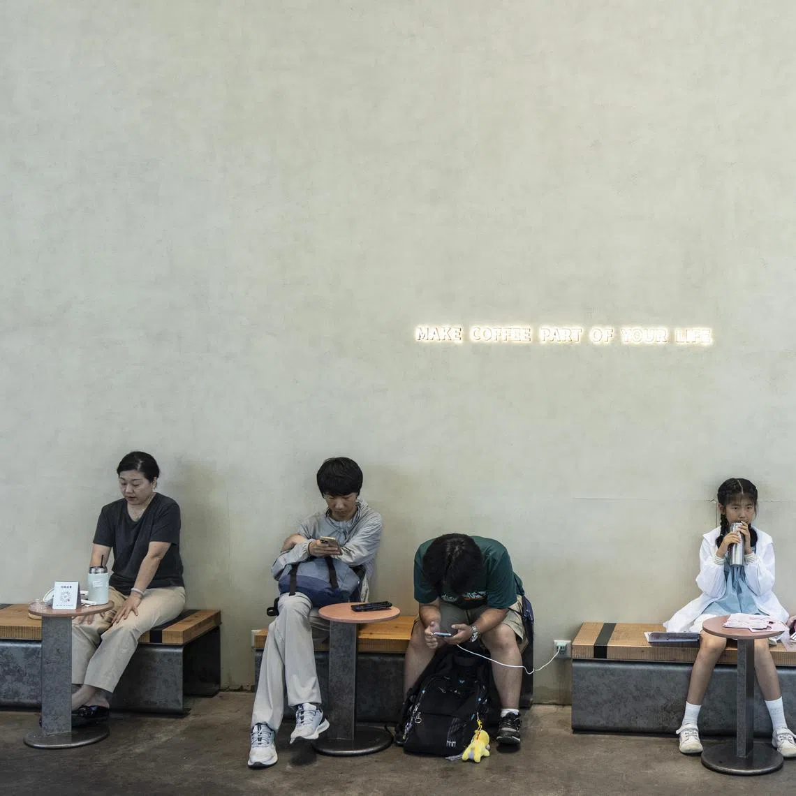 FILE Ñ People at a cafe in the township of Liangzhu, China, June 27, 2025. As Beijing pushes consumer lending to stimulate the economy, millions of Chinese borrowers, especially the young, are falling into debt spirals. (Qilai Shen/The New York Times)