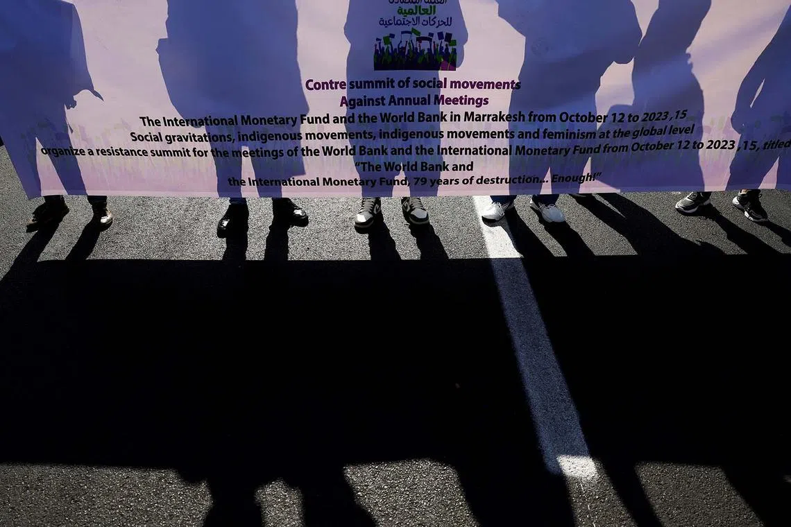 Climate activists attending a march to demand climate and debt justice on the fourth day of the annual meeting of the International Monetary Fund and the World Bank, in Marrakech, Morocco, Oct 12. 
