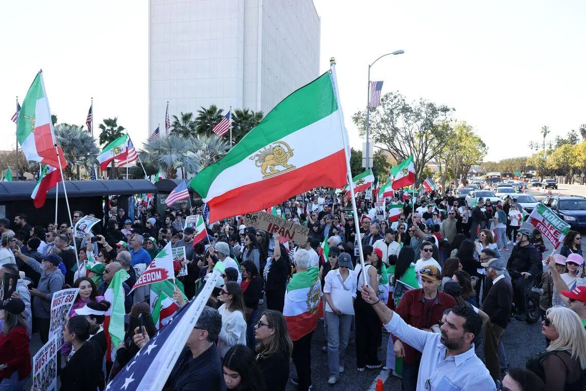 People take part in a “Free Iran” rally in Los Angeles, California, on Jan 11. US President Donald Trump has urged Iranians to keep protesting, promising help is on the way.