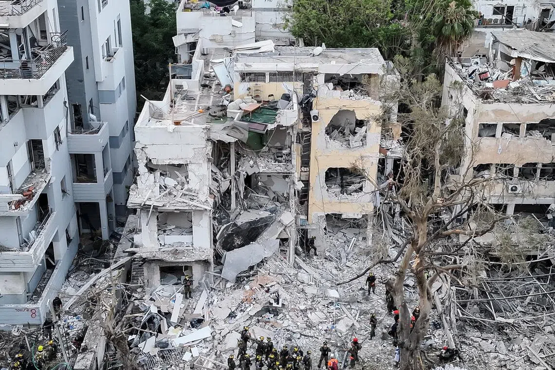 Iranian missiles struck Tel Aviv (above) and the Israeli port city of Haifa before dawn on June 16, killing at least eight people.