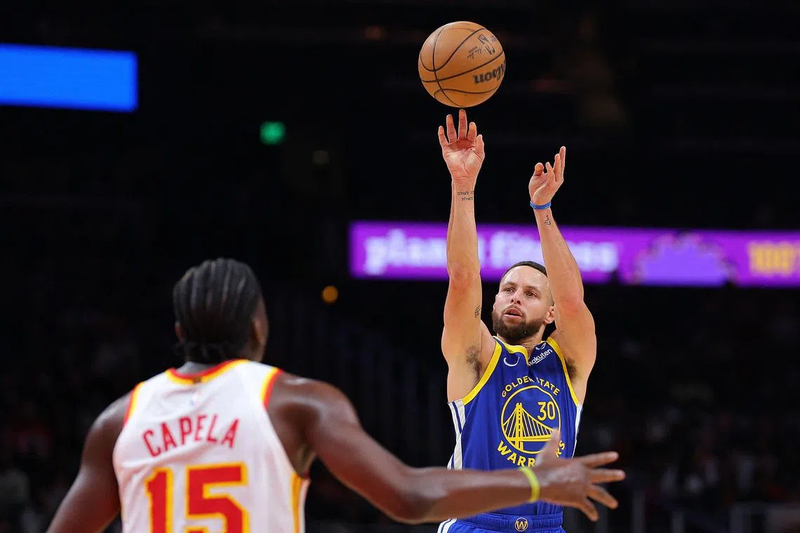 Stephen Curry of the Golden State Warriors attempting a basket against Clint Capela of the Atlanta Hawks during the third quarter at State Farm Arena on Feb 3. Curry ended with 60 points but the Warriors lost 141-134 in overtime.