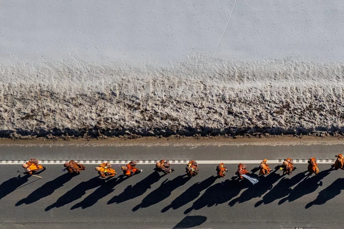 A drone photo released on Feb 10, 2026 showing monks during the “Walk for Peace”, in which a group of two dozen Buddhist monks are walking from Texas to Washington, D.C., in Spotsylvania, Virginia, U.S.