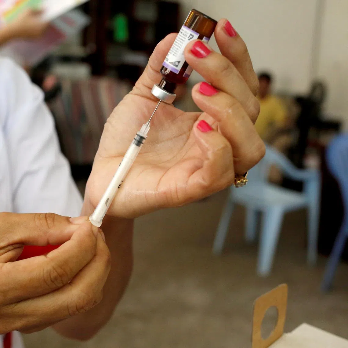 A nurse prepares a measles-rubella vaccine in Yangon, Myanmar, November 26, 2019. REUTERS/Ann Wang